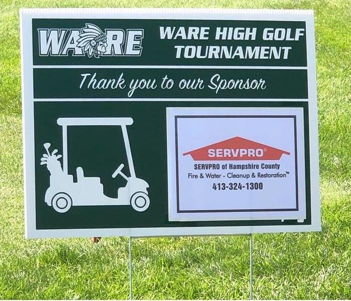 Sign in grass showing SERVPRO as hole sponsor for Ware High Golf Tournament