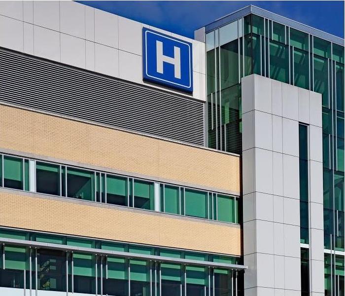 Outside view of hospital windows and hospital sign